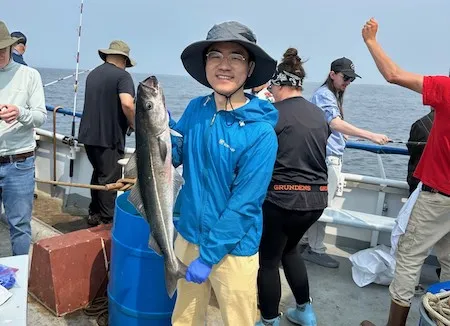 Man holding a fish.