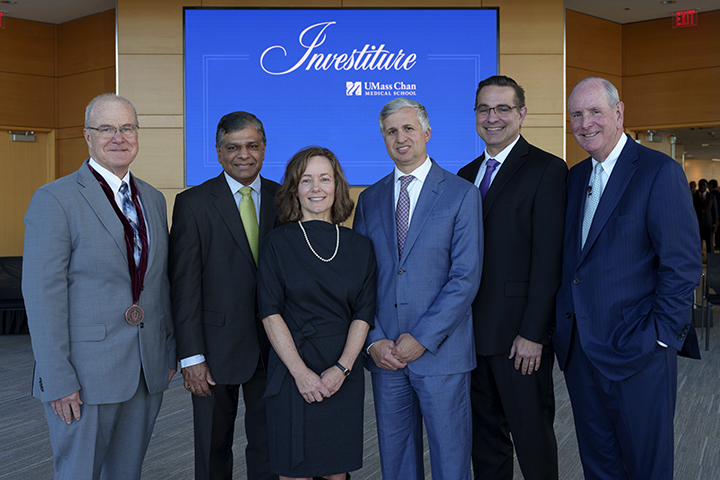 Dean Terence R. Flotte; newly invested faculty members Vaikom S. Mahadevan, MD, Sharon B. Cantor, PhD, Andres Schanzer, MD, and Michael A. Brehm, PhD; and Chancellor Michael F. Collins.