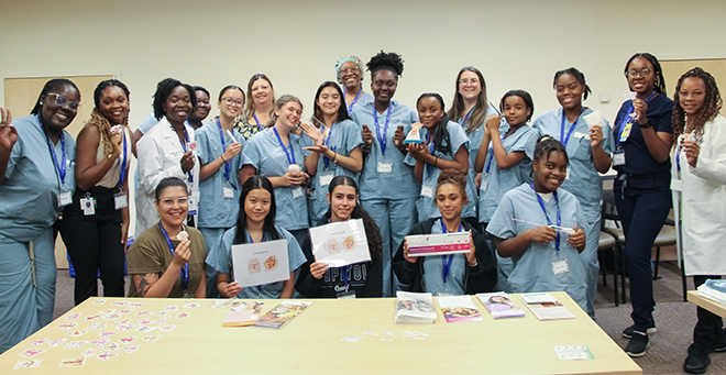 UMass Chan staff and participants from Girls Inc. during the “Day in the Life of an OB-GYN" event.  