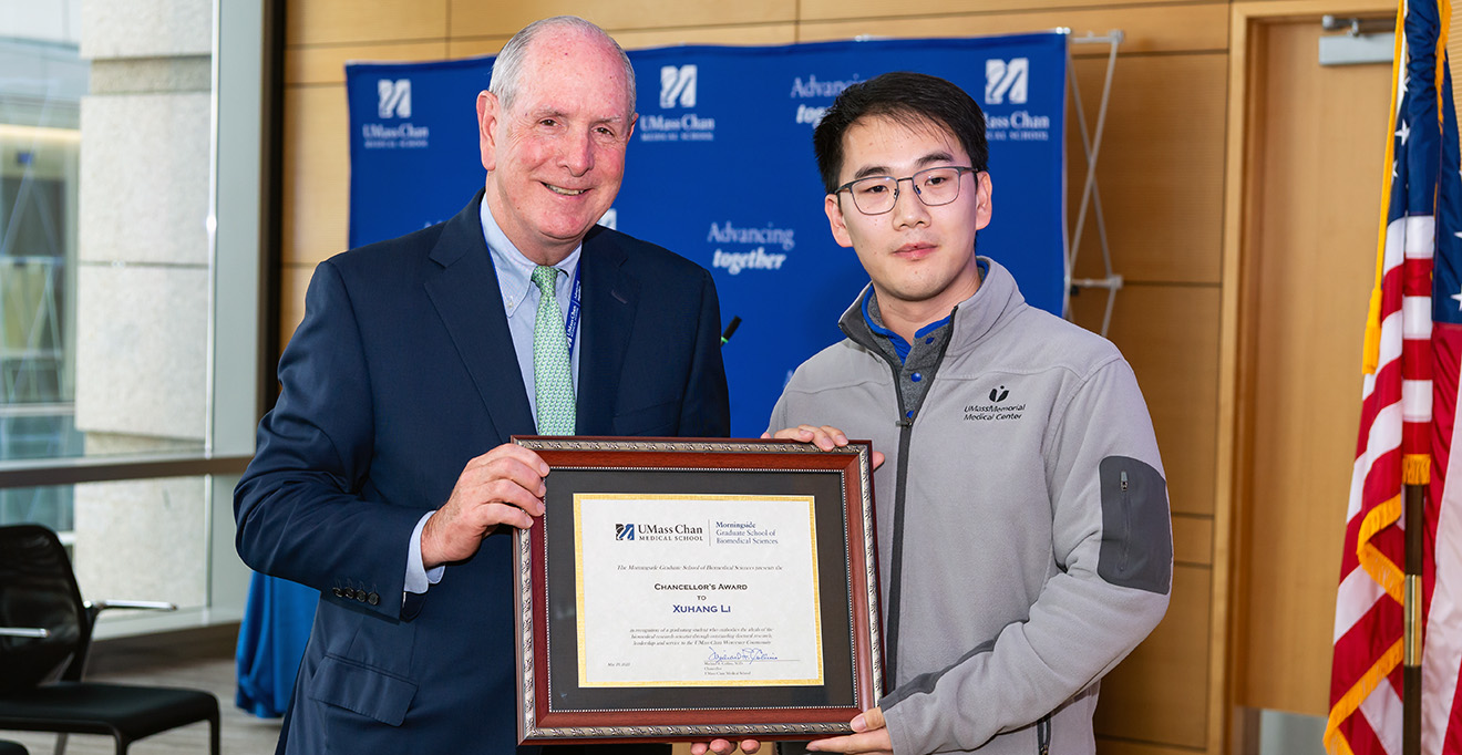 Photo of Chancellor Michael F. Collins presented the 2025 Chancellor’s Award to PhD candidate Xuhang Li.