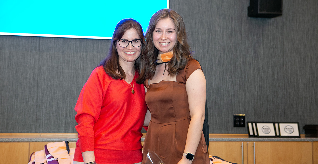 Photo of Danielle Hebert, DNP, MBA, MSN’07, ANP-BC, assistant professor of nursing and coordinator of adult-gerontology primary care nurse practitioner track, hooded her daughter, Julia Hebert, MS, BA, FNP-C, a DNP student in the Family Nurse Practitioner Track.