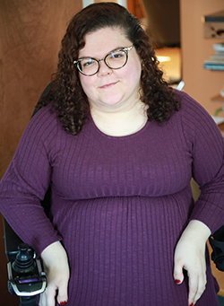 Emily Ladau wearing a purple dress