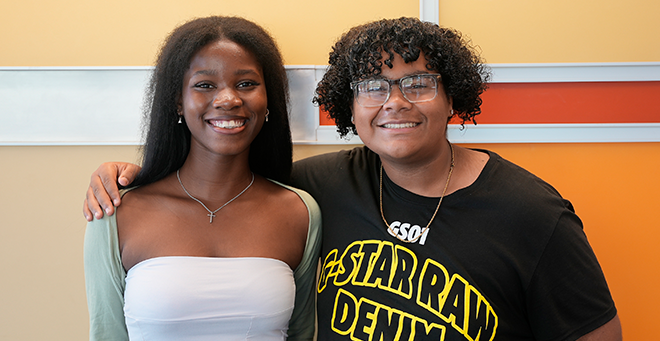 Funbi Fatoke and Yariel Lopez standing together