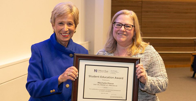 Joan Vitello-Cicciu, PhD, presents the Student Education Award to Mechelle Plasse, PhD, APRN.